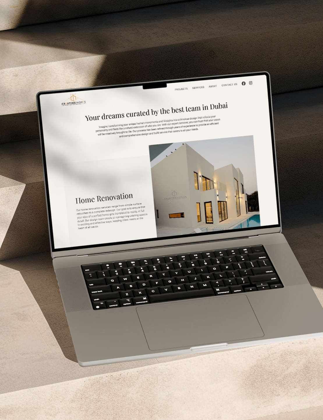 The image of laptop mockup of creating homes website designed by wings